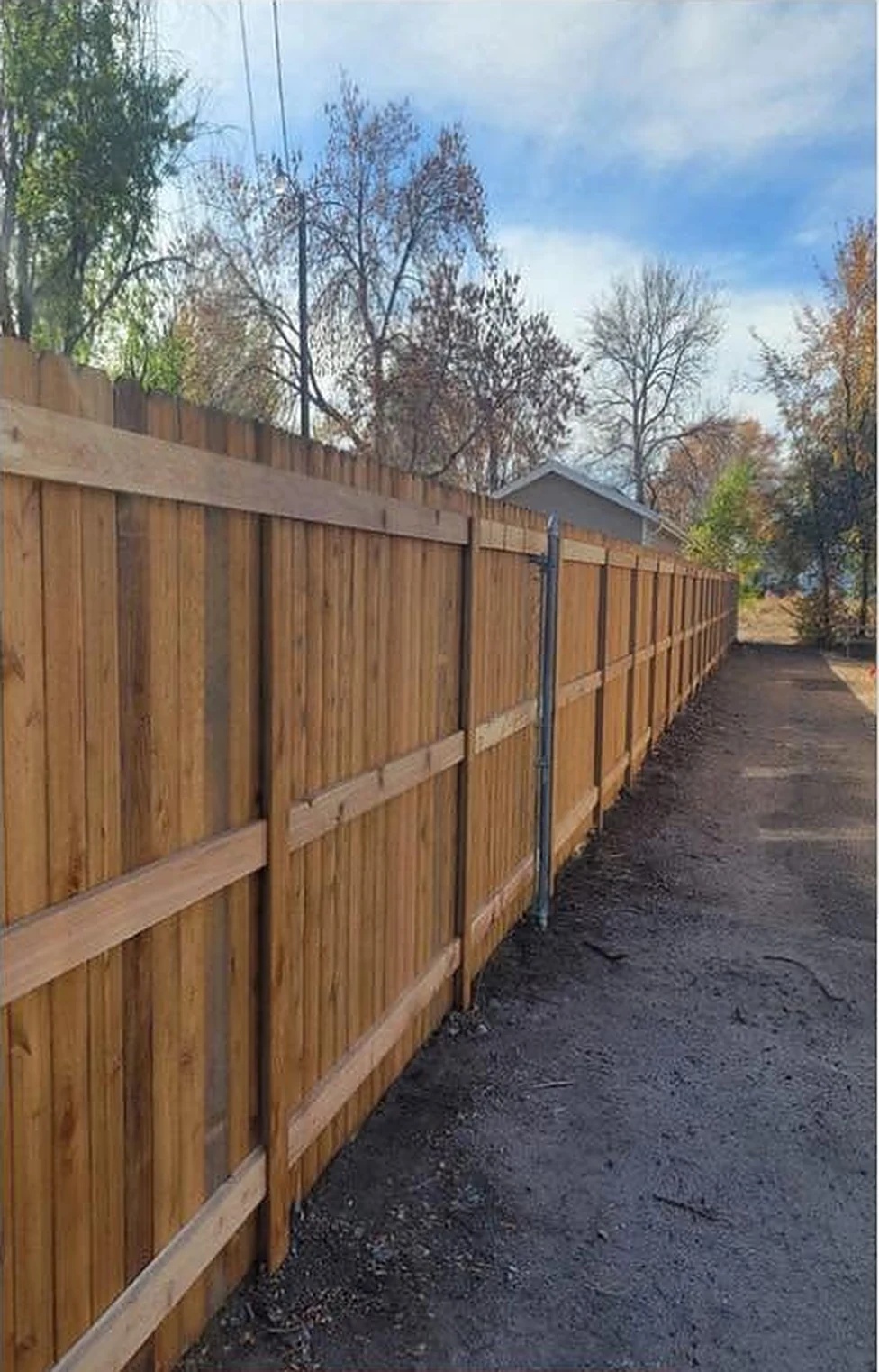 New wood privacy fence after installation